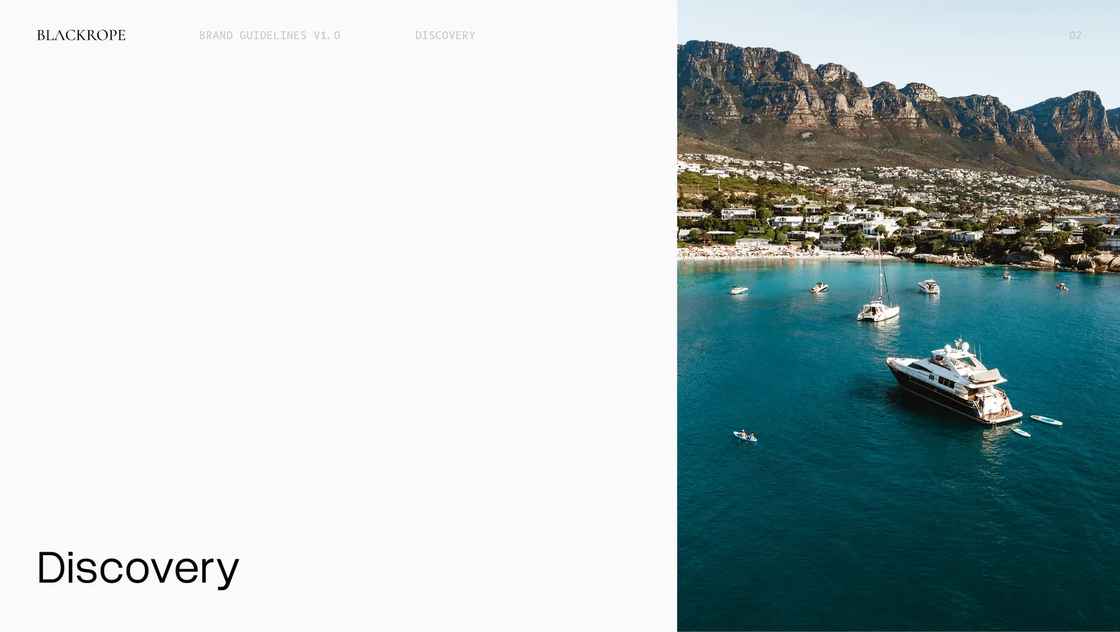 The discovery section opener, an aerial of a turquoise bay with yachts at anchor.