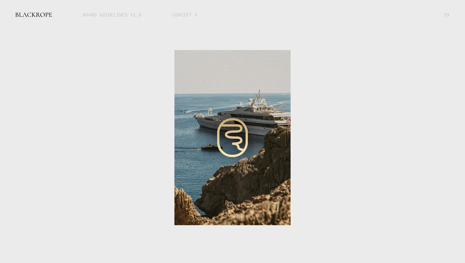 Concept one on a poster, the mark over a yacht moored under a cliff.
