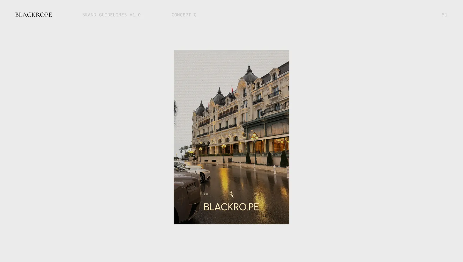 Concept three on a poster, a rain slicked hotel street at night with the mark set over it.