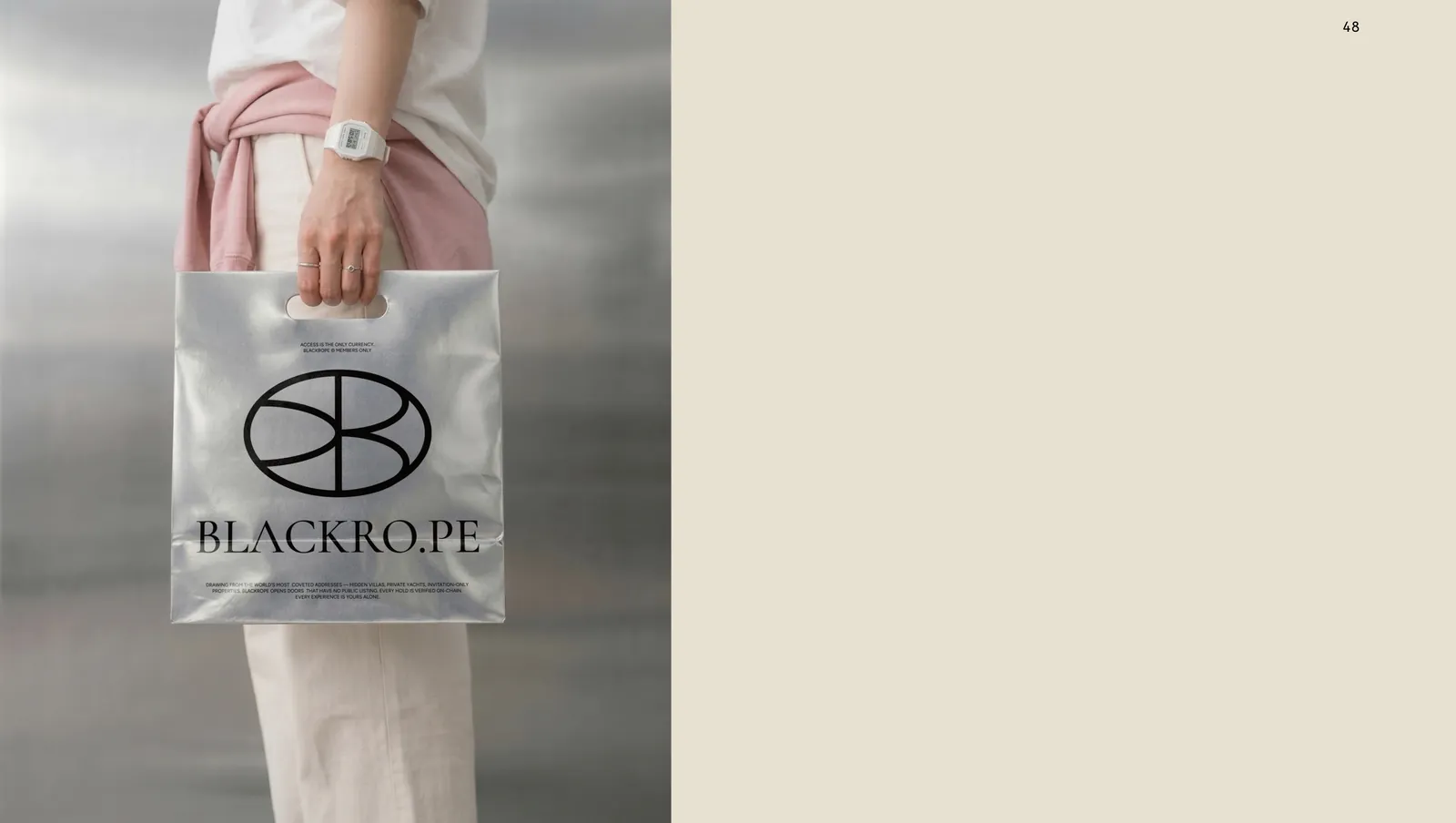 A clear shopper carried at the hip, the oval monogram and the wordmark printed on the face.